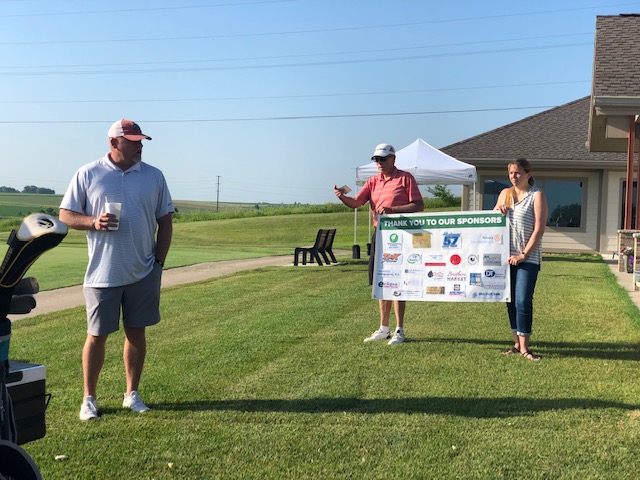 Parkersburg Chamber Volunteer Explaining the rules of the game for the Bogies and BBQ Event.